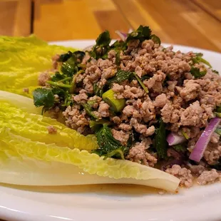 Originate from Isan the northeastern region of Thailand. Meat salad seasoned with fresh herbs, lime juice and fish sauce, and chili peppers.