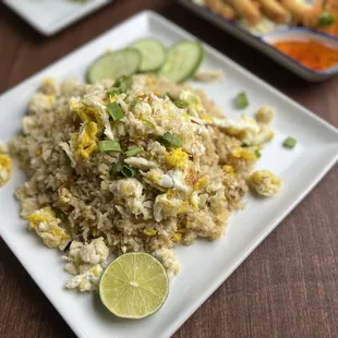 Crab Fried Rice.... Lump &amp; Claw crab meat, stir fried rice kernels,egg, our signature fried rice sauce... served with lime and cucmber...