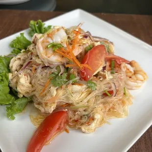 Yum Woon Sen... glasss noodles, ground chicken breast, tomatoes, shrimp, fresh lime juice, ciantro, in a house salad sauce.