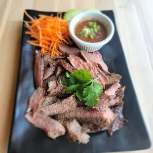 a plate of beef and vegetables