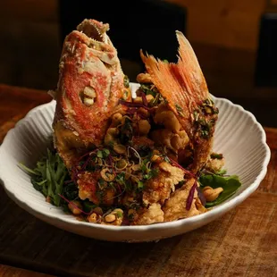 Whole Fried Red Snapper Summer Special! So tasty with spicy tamarind sauce, cashews, greens.