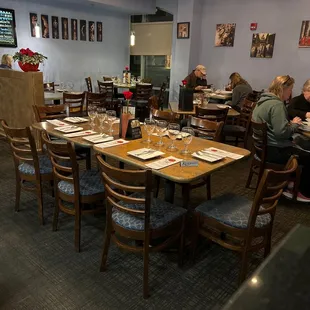a restaurant with people sitting at tables