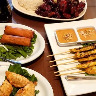 General Tso's, rice, shrimp rolls, chicken satay with peanut sauce, pot stickers.