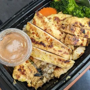 BBQ chicken over fried rice.