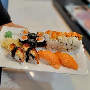 Spicy salmon roll; unagi nigiri; salmon nigiri; Black Widow Roll