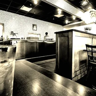 a glass of water on a bar