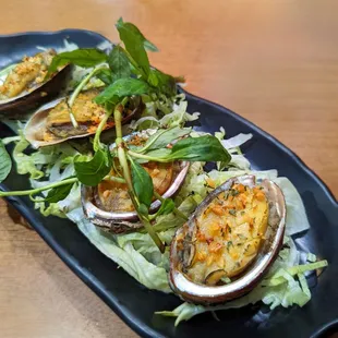 Grilled abalone in fried onions