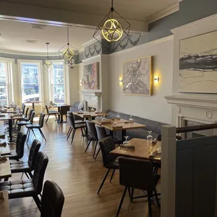 a dining room with tables and chairs