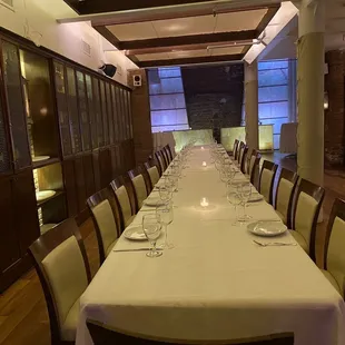 a long table set with place settings
