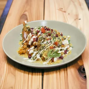 a plate of food on a wooden table