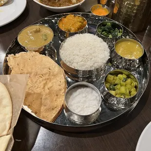 a variety of indian food on a plate