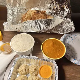 Chicken curry, garlic naan, chicken momo to go