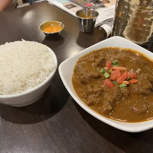 a bowl of rice and a bowl of curry