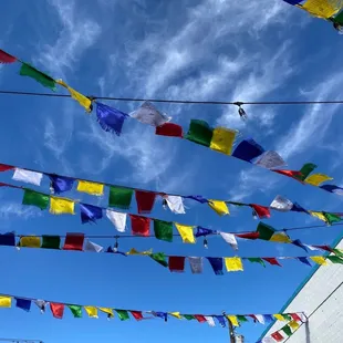 colorful flags hanging from a building