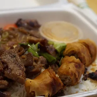 a close up of a meal in a styrofoam container