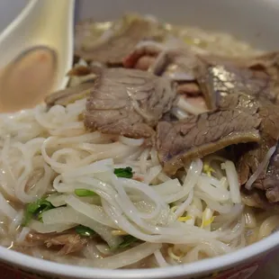 a bowl of beef and noodles