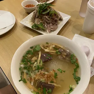 Bun mang vit, clear noodle soup with bamboo shoot and duck salad