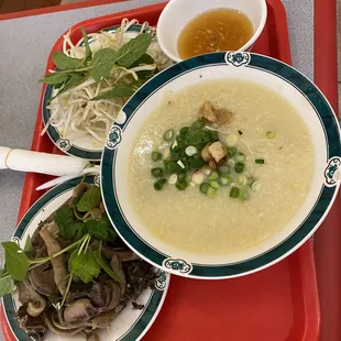 a bowl of soup and a plate of noodles