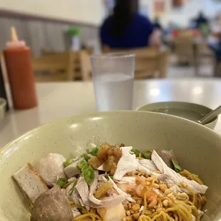 a bowl of noodles and meat