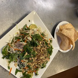 a plate of salad and chips