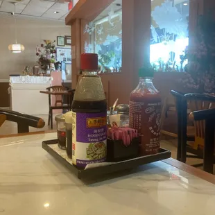 a tray of condiments on a table