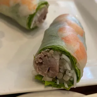 two rolls of food on a plate