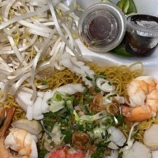 The proteins,veggies and egg noodles  for the seafood pho