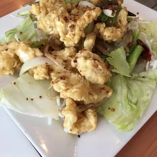 a plate of fried cauliflower and lettuce