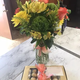 After being 'redone'. Added 1 rose and some extra filler flowers. Delivered the chocolates. Still wrong size &amp; colors, missing 3 roses.