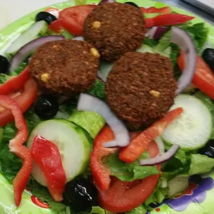 a plate of food with a salad