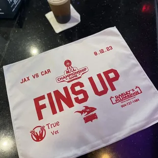 a cup of coffee and a napkin