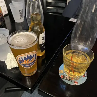 a glass of beer and a bottle of beer