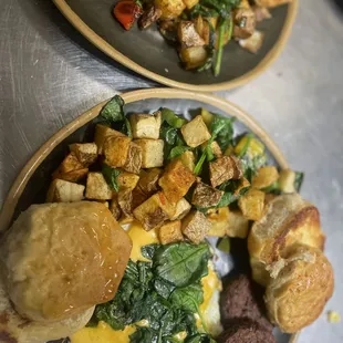 Veggie patties biscuits, fried egg with cheese, home fries with spinach
