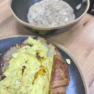 Egg, turkey sausage, and cheddar croissant with a side of turkey sausage gravy.