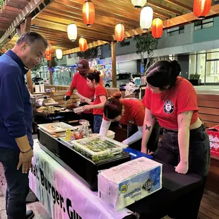 a group of people preparing food