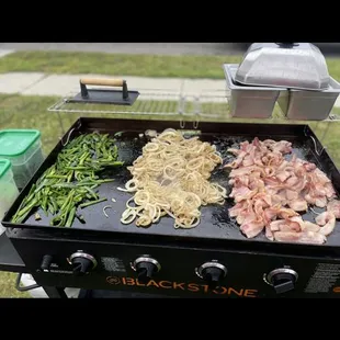 a grill with different types of food on it