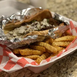 Philly cheese stake and Cajun Fries