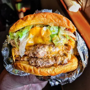 Turkey burger with lettuce, pickles, cheese, special sauce