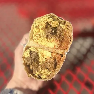 Carne Asada Breakfast Burrito: Carne Asada, 3 Eggs, Tater Tots, Cheese &amp; Choice of Salsa