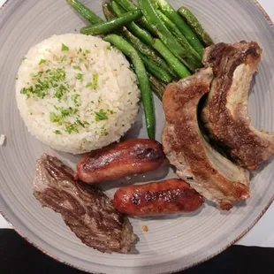 Churrasco- pichana steak or something like that, sausages, beef ribs, green beans, rice pilaf