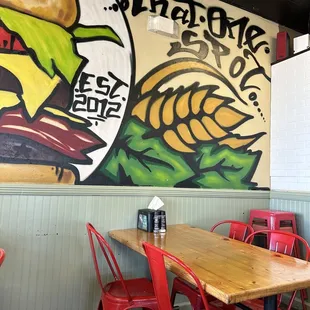 a table and red chairs