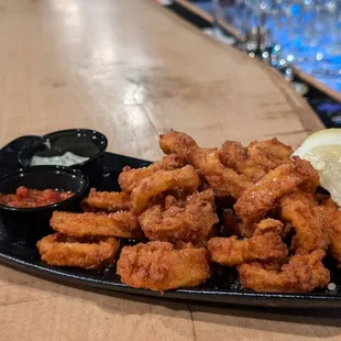 Hand breaded calamari with pesto and marinara for dipping