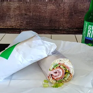 Neatly wrapped sub and a unique soda