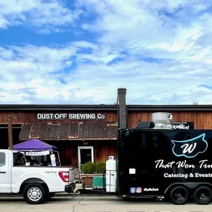 a truck parked in front of a building