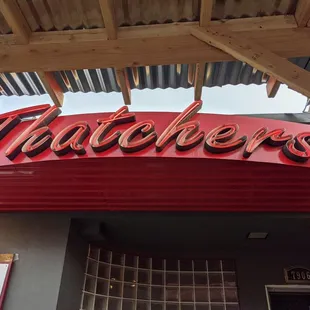 Outside sign, and seating undercover.