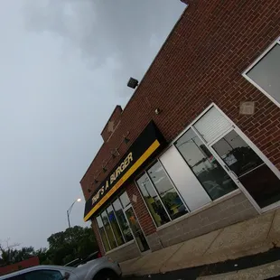 a car parked in front of a restaurant