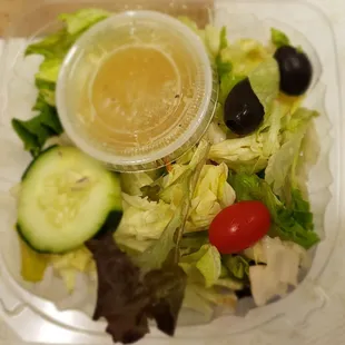 a salad in a plastic container