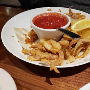 Half eaten calamari appetizer - couldn't wait to take a picture