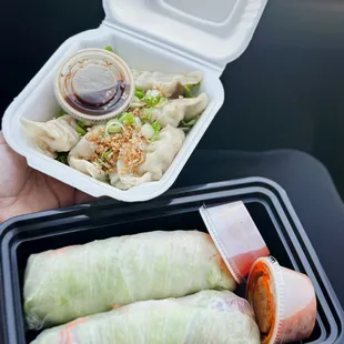 a person holding a container of food