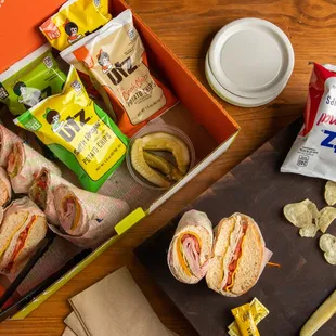 a box of sandwiches and chips